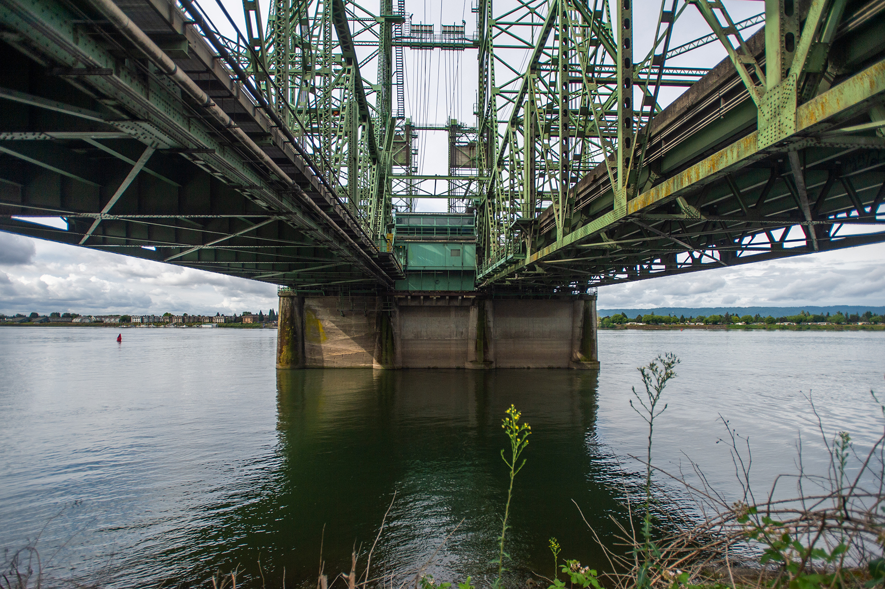 looking up at dual crossings over water 