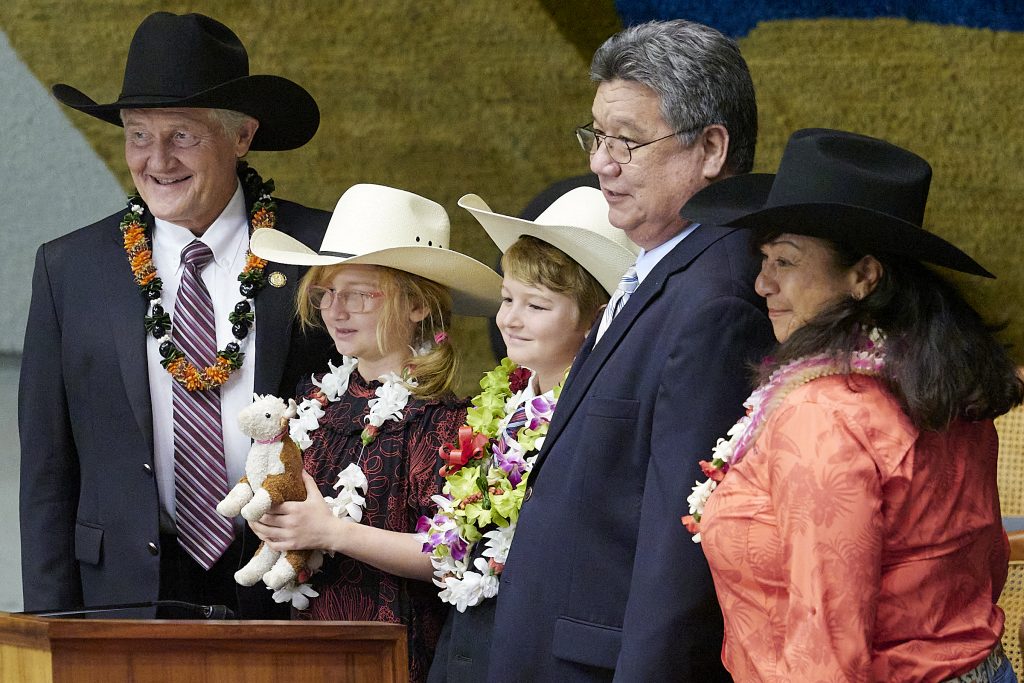 During a recent ceremony on the floor of the Hawaii Senate, Senator Herbert M. “Tim” Richards from District 4 on the Big Island joined members of his family and Senate President Kouchi to pose for a photograph.(David Croxford/Civil Beat/2024)