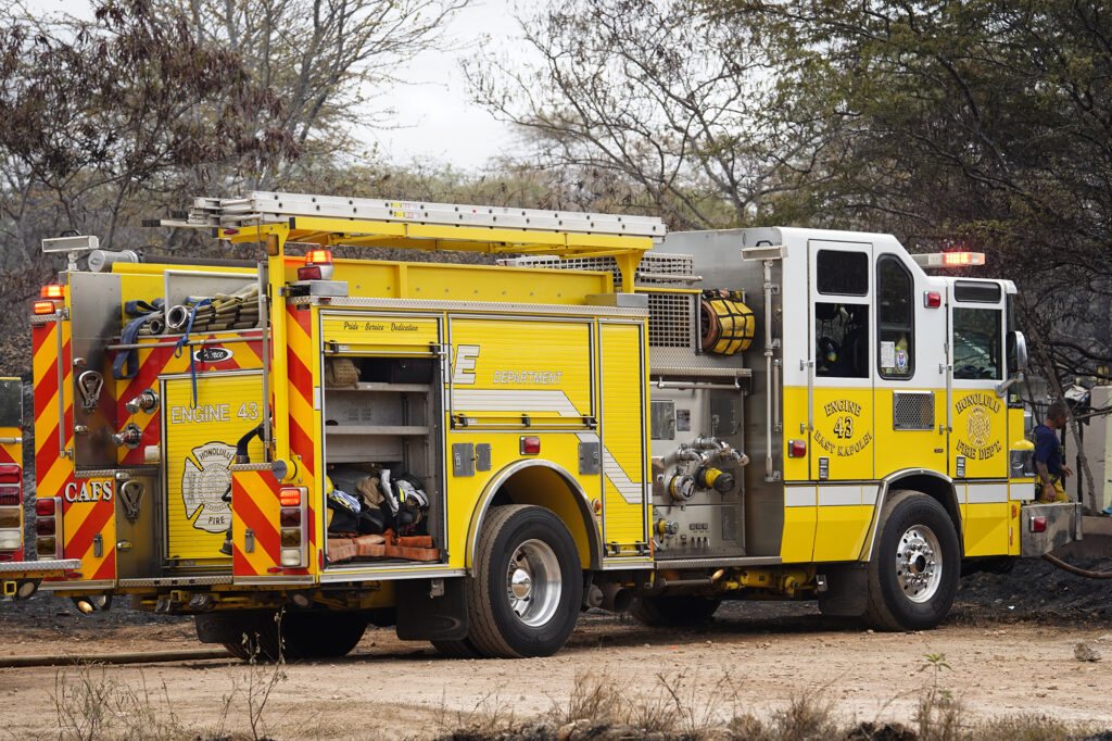 Honolulu Fire Department firefighters with Engine 43 East Kapolei continues to monitor hot spots from the previous day’s vegetation fire Monday, Sept. 16, 2024, in the Kalaeloa area of Ewa Beach. (Kevin Fujii/Civil Beat/2024)