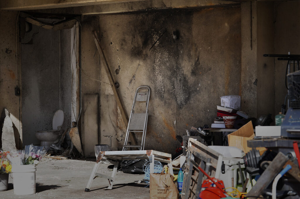 The blackened wall of a home where a deadly, New Year’s Eve fireworks explosion took place is photographed Thursday, Jan. 2, 2025, in Honolulu’s Salt Lake neighborhood. Multiple fatalities and injuries were reported. (Kevin Fujii/Civil Beat/2025)