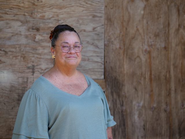 Cissy stands outside her home on the North Shore of Oahu Thursday, August 4, 2022. (Civil Beat photo Ronen Zilberman)