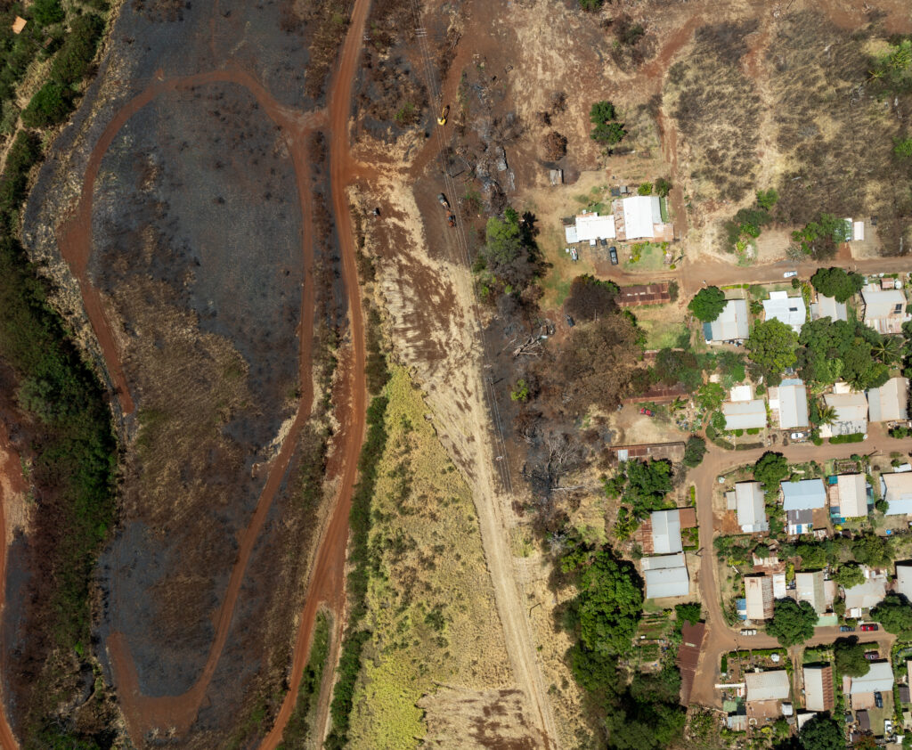 Birds Eye view of the South-East corner of Kaumakani Village in South Kauai where a burn scar show the grave proximity in which a wildfire came in mid-July.