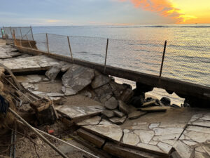 Fix It! A Collapsed Sidewalk Next To An Oceanfront Cafe