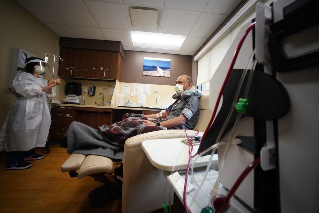 Kalani Pagan receives dialysis during a 5-week training on how to use the machines with registered nurse Linda Tsui RN looking on. The process takes a little under 3 hours.