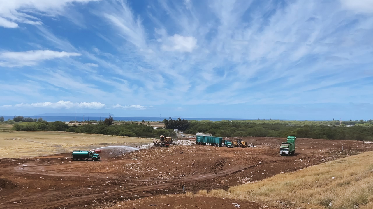 Large trucks drop off trash at the Kekaha landfill