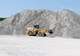 Piles of sand can act as energy storage in underground gravity energy storage. The sand would wait on the surface at a repurposed mine until it was lowered down a shaft in containers, producing energy along the descent. (Image courtesy of PxHere)