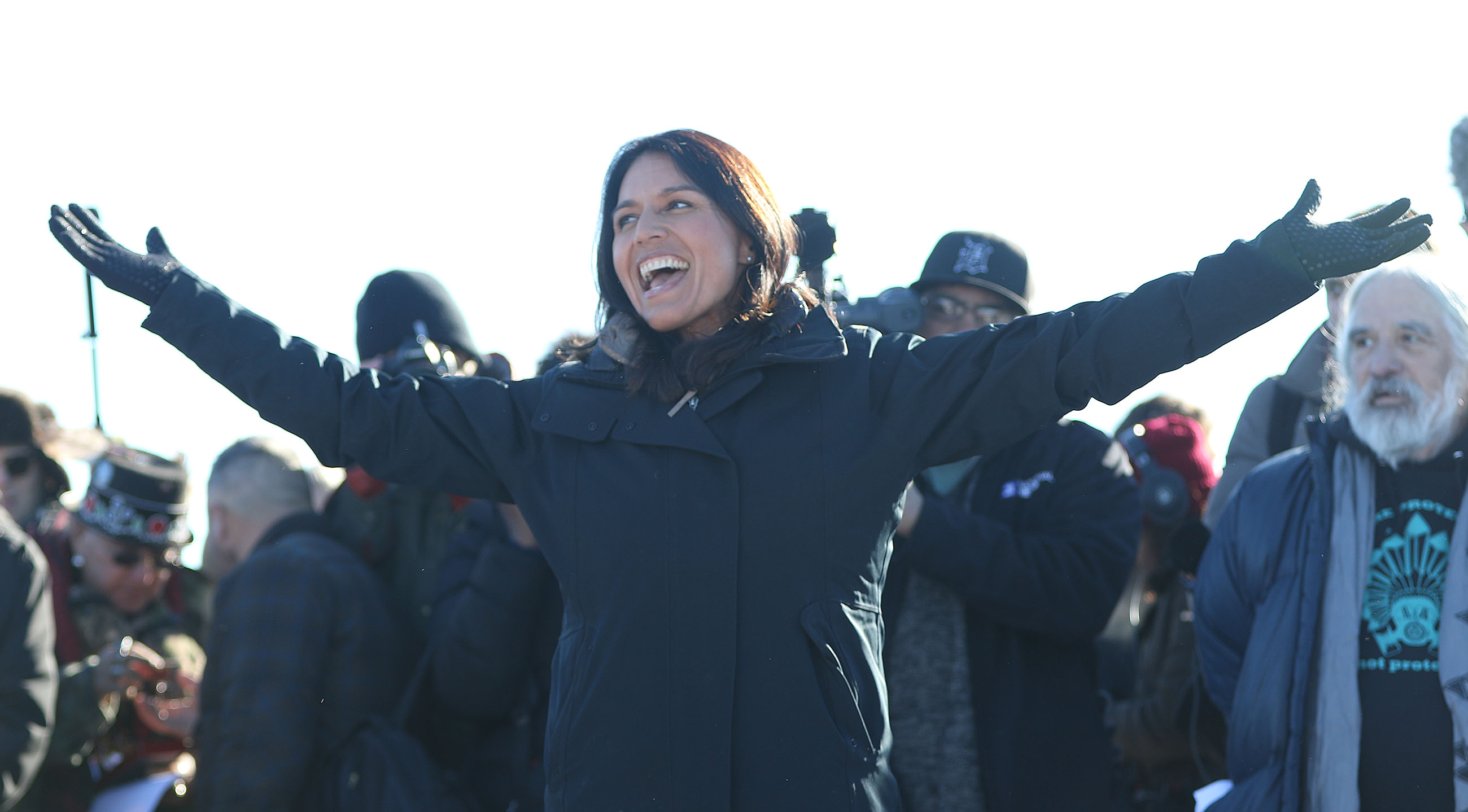 Congress woman Tulsi Gabbard greets veterans gathered for training and press conference at Cannonball field near the camp.  4 dec 2016