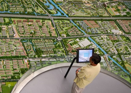 Surveyor assessing landscape with an aerial view